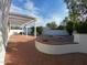 Inviting backyard featuring a covered patio, brick accents, and desert landscaping at 5564 N 77Th Pl, Scottsdale, AZ 85250