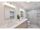 Stylish bathroom with double vanity, modern fixtures, walk-in shower, and recessed lighting at 5564 N 77Th Pl, Scottsdale, AZ 85250