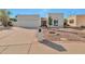 Charming single-story home featuring a well-maintained front yard and attached two-car garage at 5564 N 77Th Pl, Scottsdale, AZ 85250