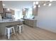 Bright kitchen featuring an island with seating and modern stainless steel appliances at 5564 N 77Th Pl, Scottsdale, AZ 85250