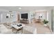 Open concept living room with bright modern decor, adjacent dining area and bright kitchen at 5564 N 77Th Pl, Scottsdale, AZ 85250