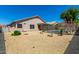 Backyard featuring a fenced pool, rock landscaping, and a covered patio area at 6539 W Briles Rd, Phoenix, AZ 85083