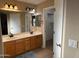 Spacious bathroom with double sinks, ample countertop space, and a walk-in closet at 6539 W Briles Rd, Phoenix, AZ 85083