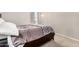 Cozy bedroom showcasing soft lighting and a comfortable bed with decorative pillows at 6539 W Briles Rd, Phoenix, AZ 85083