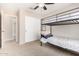 Bedroom with bunk beds and closet, perfect for a ' room or guest room at 6539 W Briles Rd, Phoenix, AZ 85083