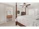 Bedroom featuring a bed, ceiling fan, carpet, and ensuite bathroom at 6539 W Briles Rd, Phoenix, AZ 85083
