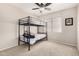 Bedroom showcasing carpet floors, a bunk bed, and natural light from the window at 6539 W Briles Rd, Phoenix, AZ 85083