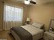 Cozy bedroom featuring a comfortable bed, soft lighting, and ample natural light for relaxation at 6539 W Briles Rd, Phoenix, AZ 85083