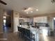 Bright, open kitchen with a large island, stainless steel appliances, and modern finishes at 6539 W Briles Rd, Phoenix, AZ 85083