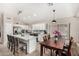 Bright kitchen features an island, stainless steel appliances, and ample cabinet space at 6539 W Briles Rd, Phoenix, AZ 85083