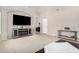 Spacious living room with entertainment center, fireplace, and plush carpeting at 6539 W Briles Rd, Phoenix, AZ 85083
