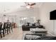 Open concept living space features tile floors, modern furniture, and a bright, airy ambiance at 6539 W Briles Rd, Phoenix, AZ 85083
