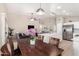 Open-concept living area seamlessly connects the dining room, living room, and kitchen at 6539 W Briles Rd, Phoenix, AZ 85083
