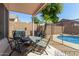 Outdoor patio area with barbecue, dining table, and pool view, perfect for entertaining at 6539 W Briles Rd, Phoenix, AZ 85083