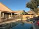 Sparkling in-ground pool in a private backyard with a desert landscape at 6539 W Briles Rd, Phoenix, AZ 85083