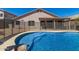 Backyard pool features tile detail and security fencing at 6539 W Briles Rd, Phoenix, AZ 85083