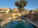 Private in-ground pool with desert landscaping and mountain views in the background at 6539 W Briles Rd, Phoenix, AZ 85083