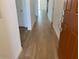 Inviting entryway showcasing wood-look tile flooring that flows into the home's living spaces at 7417 E Hackamore Ln, San Tan Valley, AZ 85143