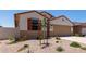 Charming single-story home with a two-car garage, low-maintenance landscaping, and a welcoming front entrance at 7417 E Hackamore Ln, San Tan Valley, AZ 85143