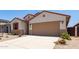 Charming single-story home with a two-car garage, low-maintenance landscaping, and a welcoming front entrance at 7417 E Hackamore Ln, San Tan Valley, AZ 85143