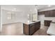 Modern kitchen featuring a large island, stylish countertops, stainless steel appliances, and ample cabinet space at 7417 E Hackamore Ln, San Tan Valley, AZ 85143