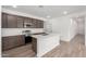 Modern kitchen featuring a large island, stylish countertops, stainless steel appliances, and ample cabinet space at 7417 E Hackamore Ln, San Tan Valley, AZ 85143