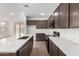 Modern kitchen featuring a large island, stylish countertops, stainless steel appliances, and ample cabinet space at 7417 E Hackamore Ln, San Tan Valley, AZ 85143