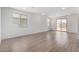 Bright, open living room featuring tile floors, large windows, and sliding glass doors at 7417 E Hackamore Ln, San Tan Valley, AZ 85143