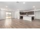 Bright, open-concept living room flows into a kitchen with a large island and sliding glass door access at 7417 E Hackamore Ln, San Tan Valley, AZ 85143
