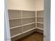 Walk-in pantry offering ample storage space with multiple shelves for organization at 7417 E Hackamore Ln, San Tan Valley, AZ 85143