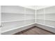 Spacious walk-in pantry features ample shelving for optimal organization and storage at 7417 E Hackamore Ln, San Tan Valley, AZ 85143