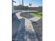Paver walkway to the pool, artificial turf and pea gravel for a modern landscape at 7637 E Akron St, Mesa, AZ 85207