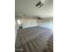 A spacious living room with neutral carpet and an abundance of natural light at 7637 E Akron St, Mesa, AZ 85207
