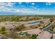 Beautiful aerial shot captures this exclusive community, canal, walking path, and desert landscaping at 7678 E Cactus Wren Rd, Scottsdale, AZ 85250