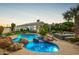 Beautiful backyard with pool, spa, patio area, and lush landscaping; perfect for outdoor living at 7678 E Cactus Wren Rd, Scottsdale, AZ 85250