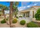 Lush backyard with patio, outdoor grill, mature landscaping and desert accents at 7678 E Cactus Wren Rd, Scottsdale, AZ 85250