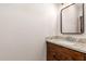 Bathroom featuring granite countertops and wood cabinets at 7678 E Cactus Wren Rd, Scottsdale, AZ 85250