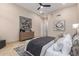 Bedroom with natural light featuring a king bed, dresser, and decorative art at 7678 E Cactus Wren Rd, Scottsdale, AZ 85250
