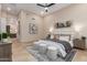 Spacious bedroom featuring a king bed, decorative rug, and ensuite bathroom at 7678 E Cactus Wren Rd, Scottsdale, AZ 85250