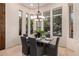 Elegant dining room features a modern chandelier and ample natural light at 7678 E Cactus Wren Rd, Scottsdale, AZ 85250