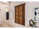 Hallway with decorative wooden piece and modern decor at 7678 E Cactus Wren Rd, Scottsdale, AZ 85250