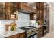 Kitchen featuring granite countertops, subway tile backsplash, and stainless steel oven at 7678 E Cactus Wren Rd, Scottsdale, AZ 85250