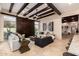 Bright living room with beamed ceilings, bar access and stylish furnishings at 7678 E Cactus Wren Rd, Scottsdale, AZ 85250