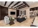 Bright living room with beamed ceilings, television, and stylish furnishings at 7678 E Cactus Wren Rd, Scottsdale, AZ 85250