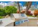 Outdoor grill area with stainless steel barbeque and countertop prep space at 7678 E Cactus Wren Rd, Scottsdale, AZ 85250