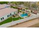 Beautiful backyard boasts a pool with tropical landscaping and an outdoor living area at 7678 E Cactus Wren Rd, Scottsdale, AZ 85250