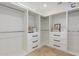 Spacious walk-in closet with custom shelving and drawers, offering ample storage at 7678 E Cactus Wren Rd, Scottsdale, AZ 85250