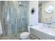Modern bathroom with marble countertops and walk-in shower featuring a rainfall showerhead at 7703 E Overlook Dr, Scottsdale, AZ 85255
