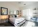 Bright bedroom with stylish decor, including decorative mirrors and side tables with lamps at 7703 E Overlook Dr, Scottsdale, AZ 85255