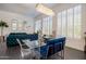 Stylish dining room featuring a glass table, modern chandelier, and comfortable seating at 7703 E Overlook Dr, Scottsdale, AZ 85255